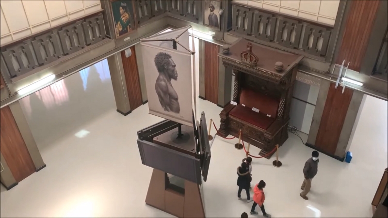 Visitors walk through the main hall of the National Museum of Ethiopia