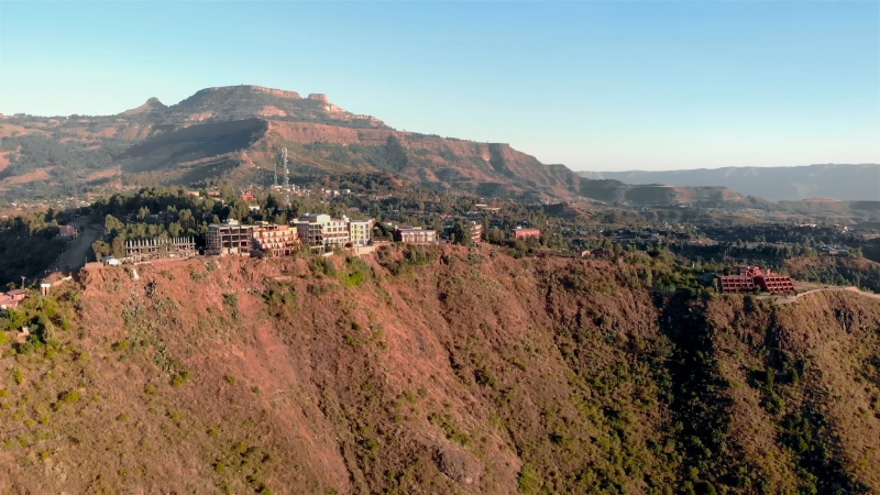 A small town clings to the edge of a dramatic cliff in Ethiopia’s highlands